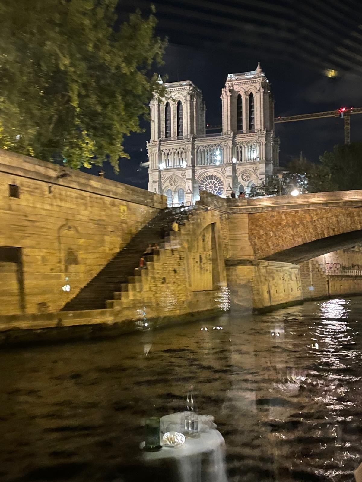 Notre-Dame at night seen from the Seine