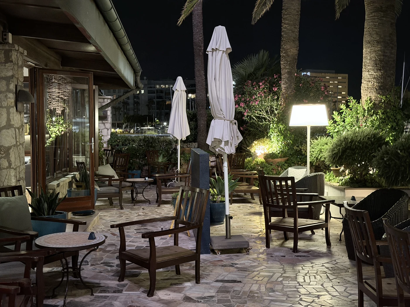 The lit terrace of Hotel Portixol in the evening.