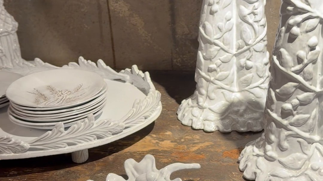 White china by Astier de Villatte on an old wooden table.