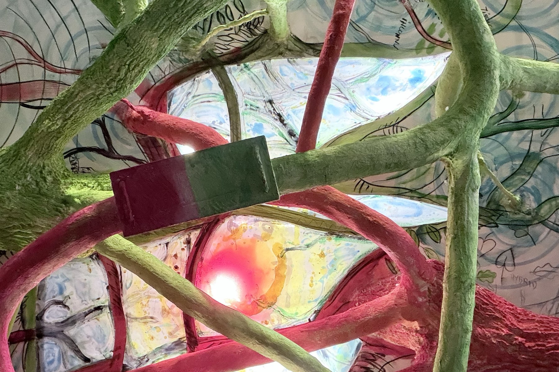 Branches painted green and red, part of the work Les Deux Chênes, under a painted ceiling